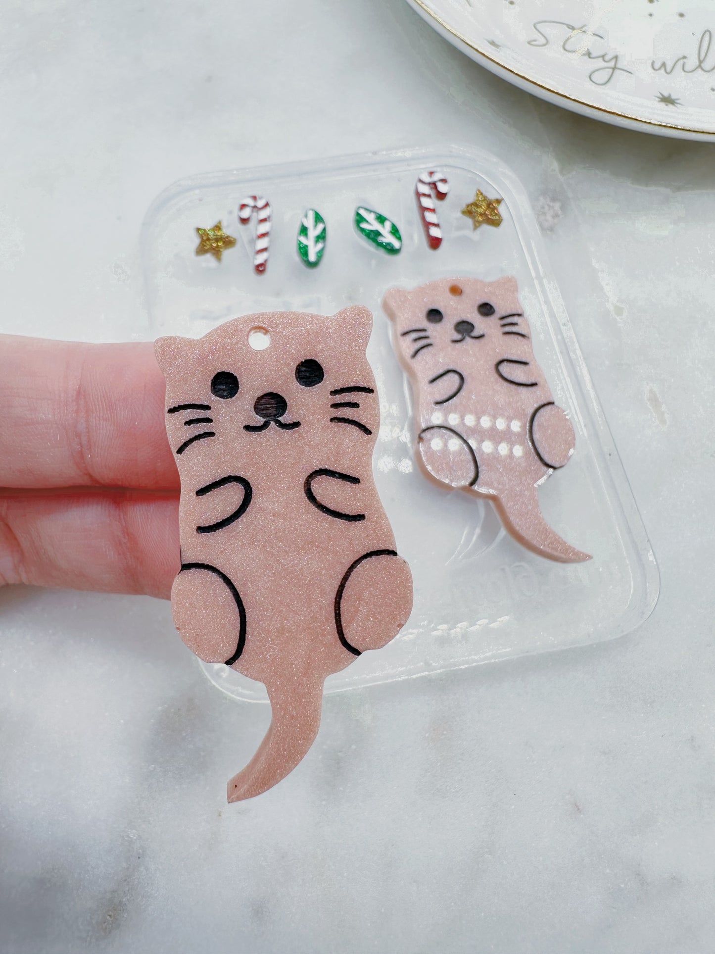 Autumn Sea Otter Dangle Earring with Christmas Candy Cane